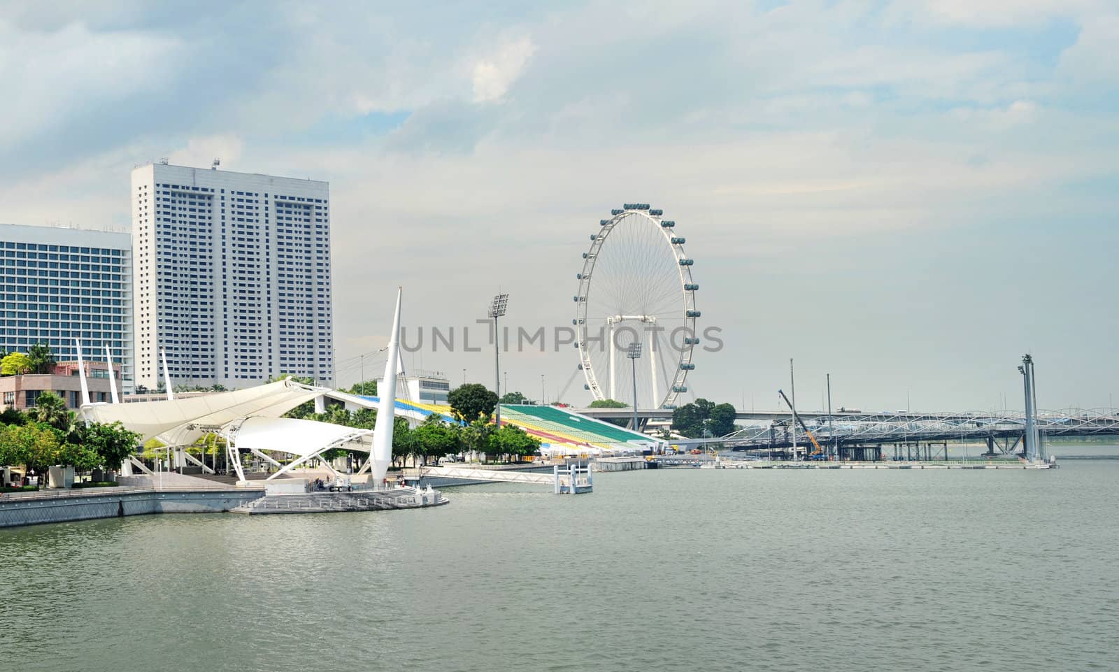 Embankment of Singapore and Singapore Flyer in the sunshine day