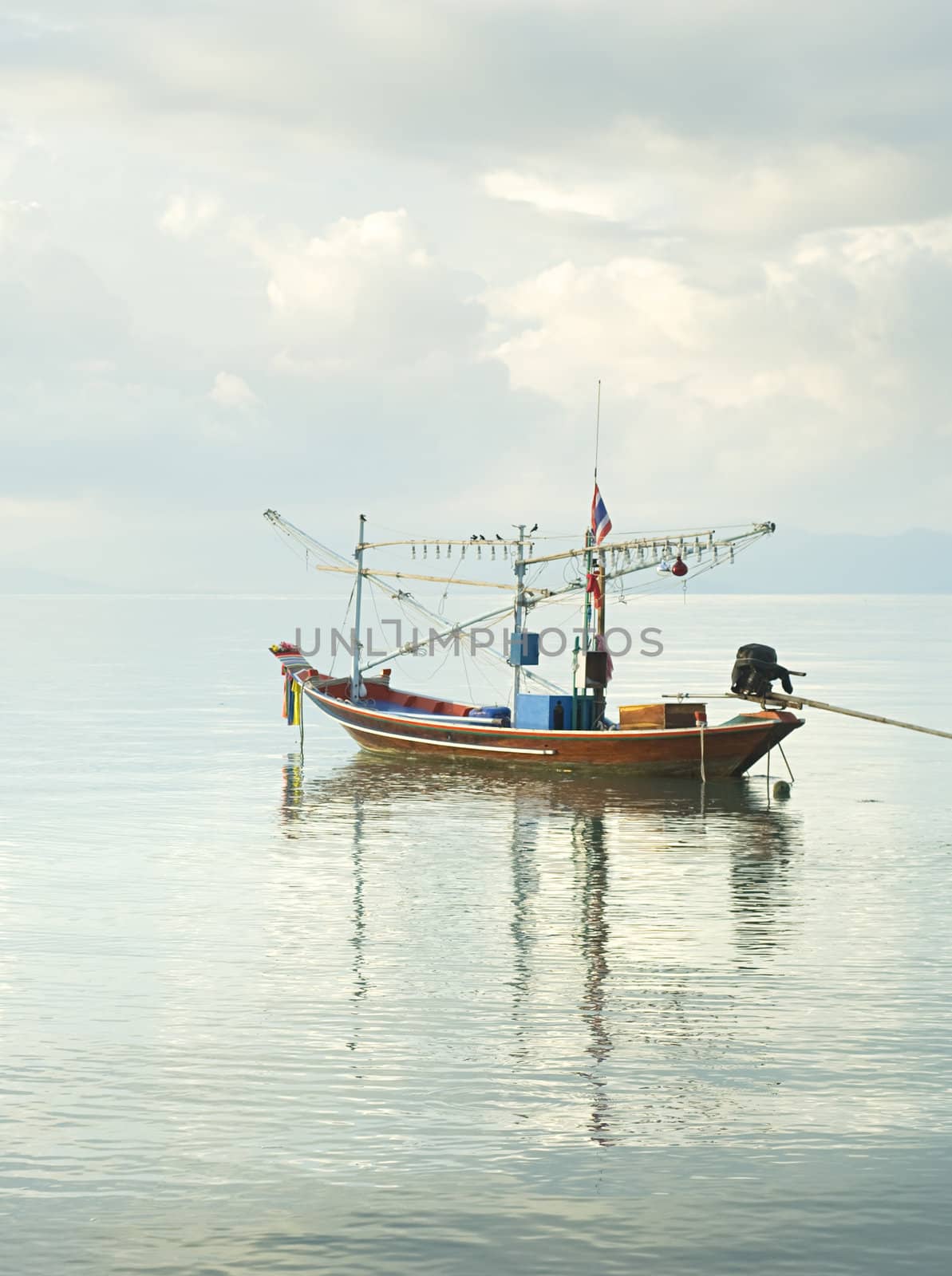 Traditional thailand boat  in the sea at sunrise