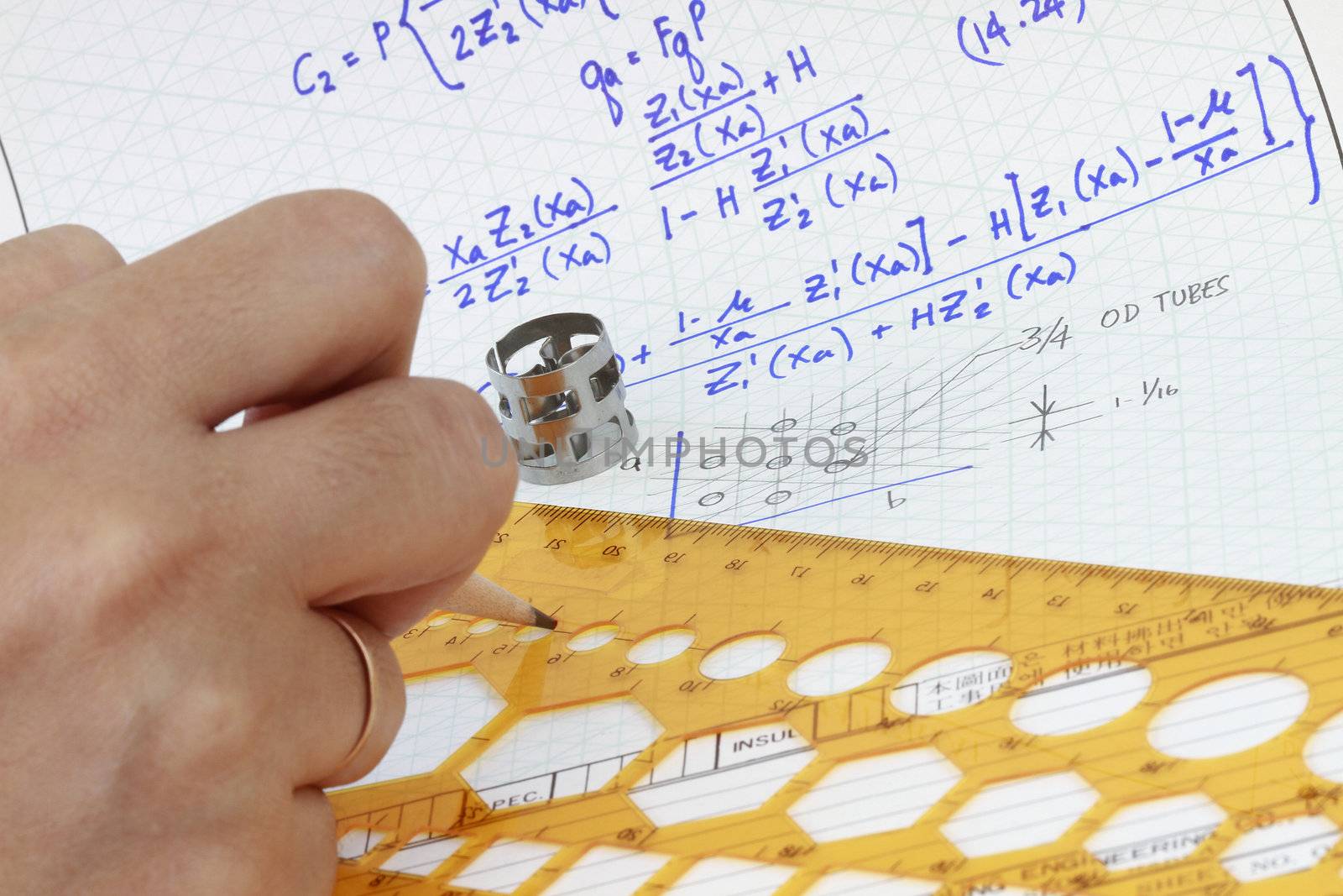 Mathematics formula on engineering notes with sketch.