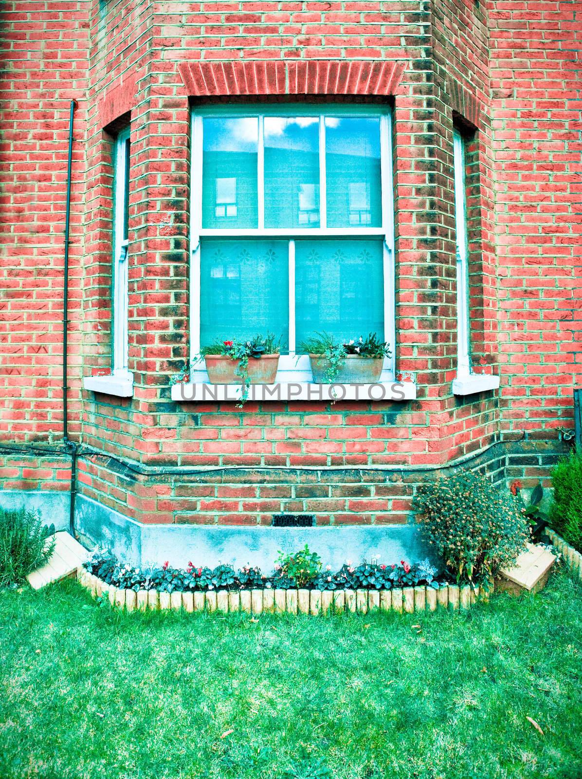 Front of an old english house in striking cold tones