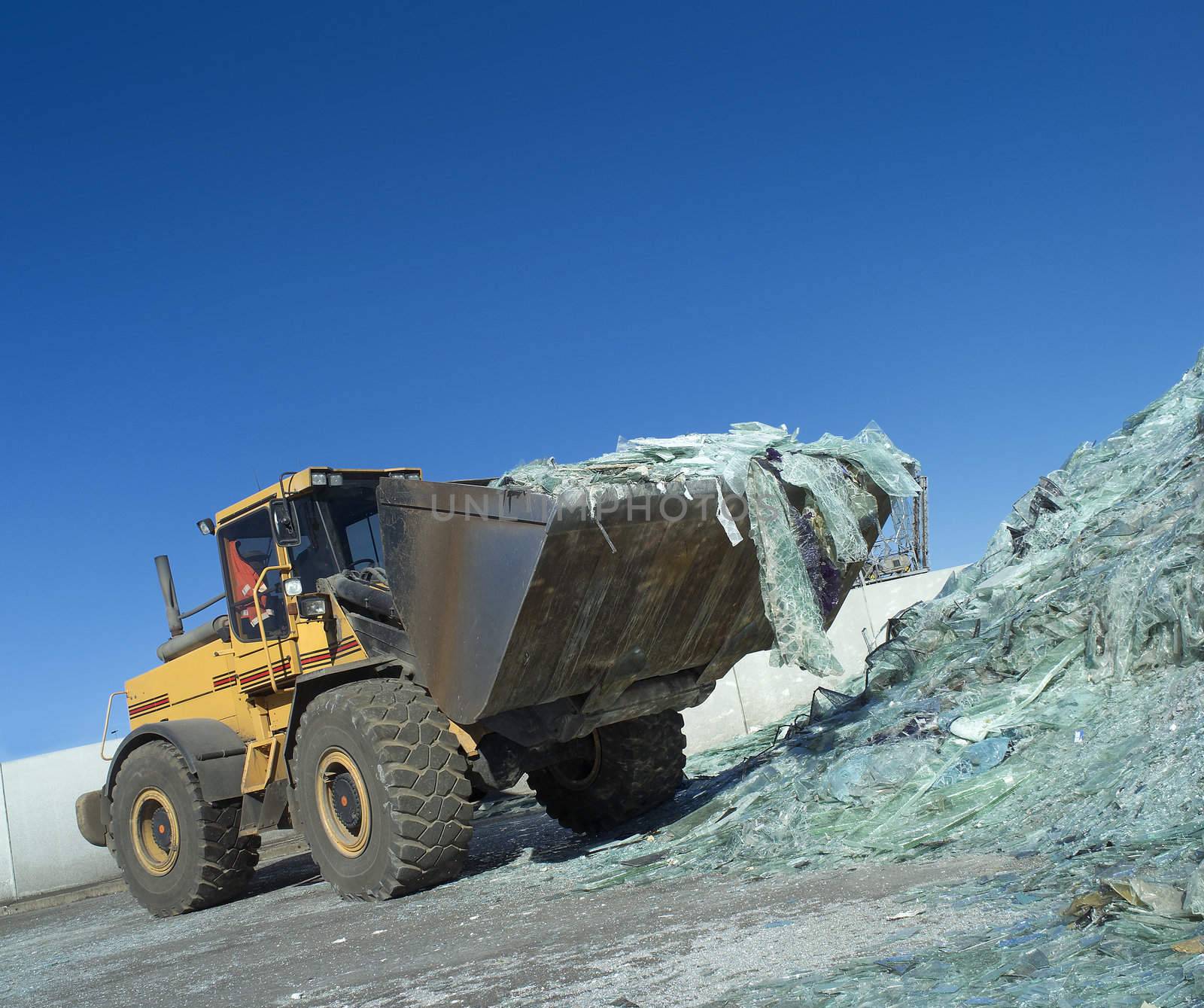 Truck carrying glass towards blue sky