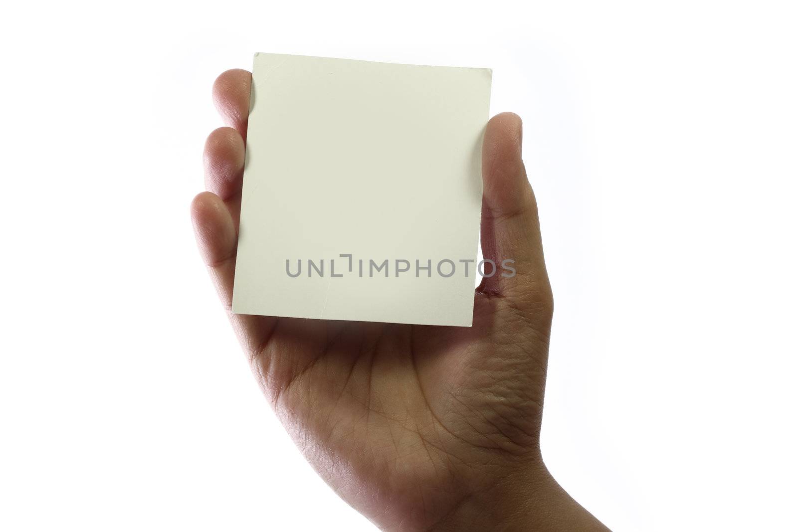 Hand holding blank business card with copy space.
