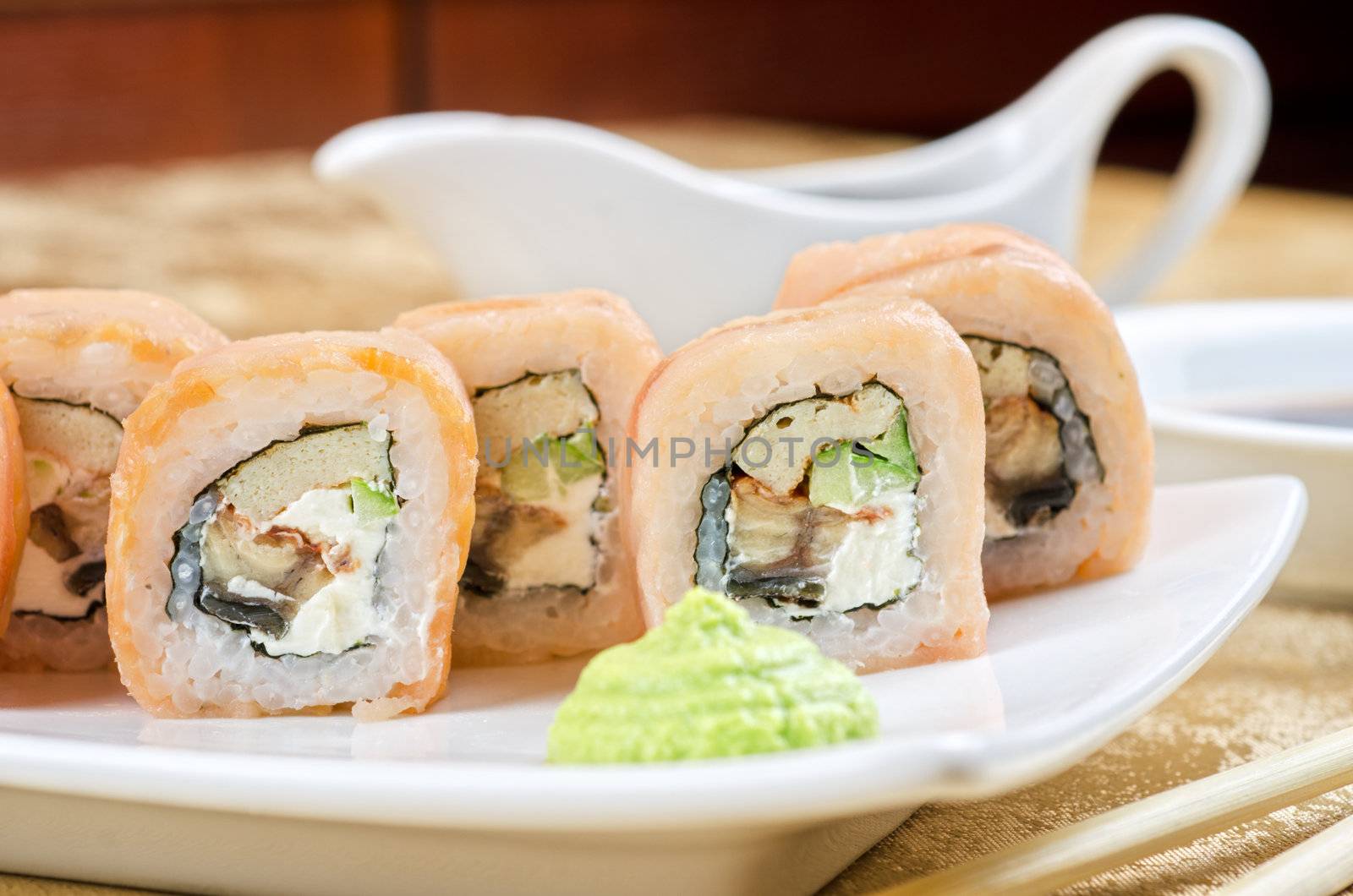 sushi roll of shrimp, eel, cucumber, pepper and sauce
