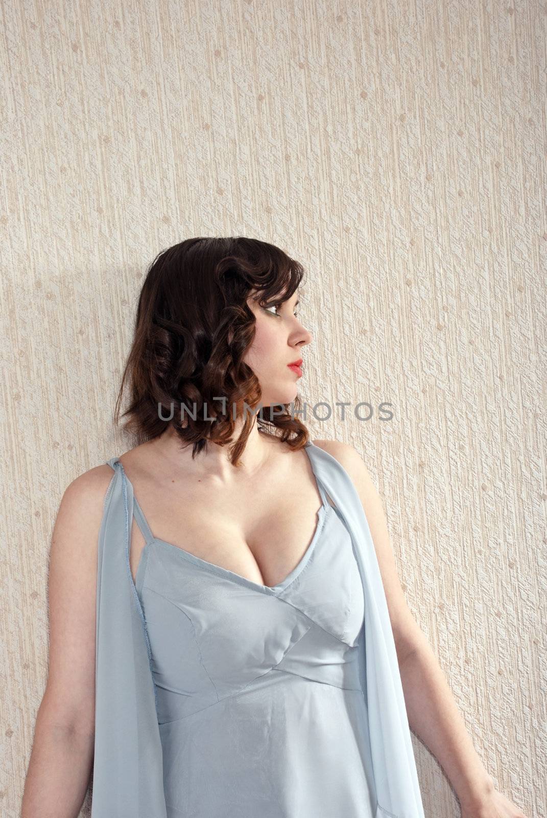Beautiful fashion woman looks in the direction