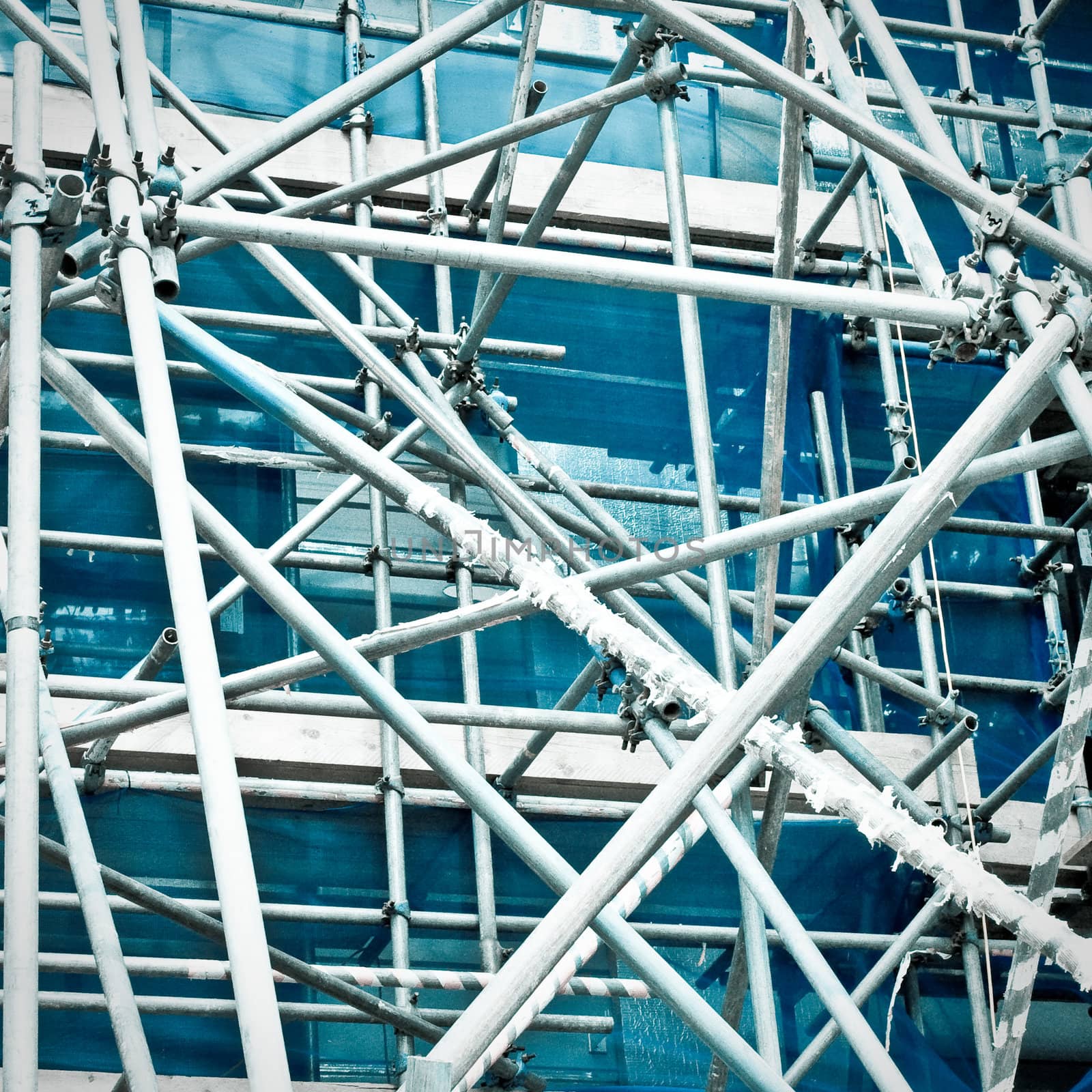Abstract image of a complicated arrangement of metal bars as part of scaffolding
