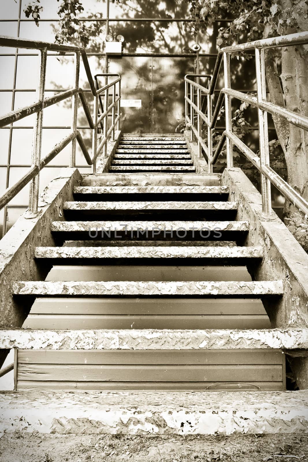 Sepia image of a flight of outside metal stairs