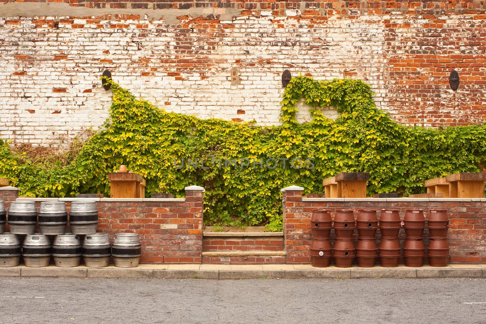 Plastic and metal barrels in a UK pub garden