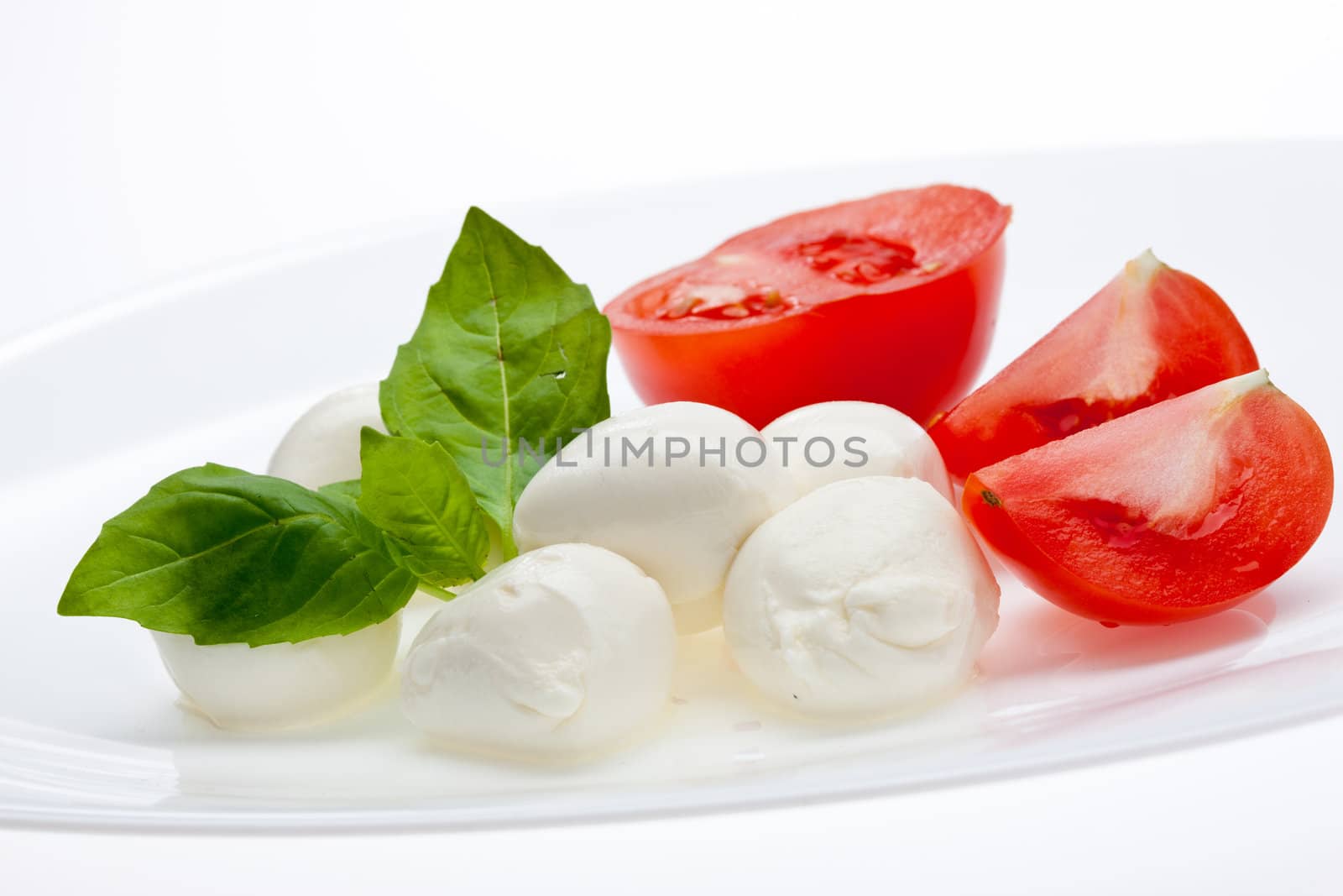 food series: mozzarella, tomato and basil over white