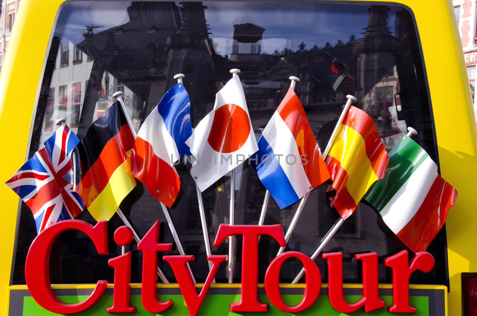 city tour bus for tourists detail with flags in Belgium
