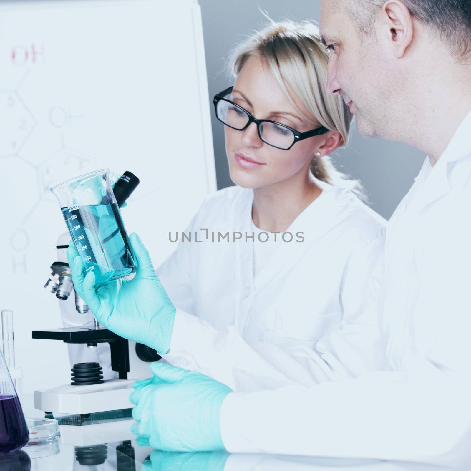  two scientist in chemical lab conducting experiments