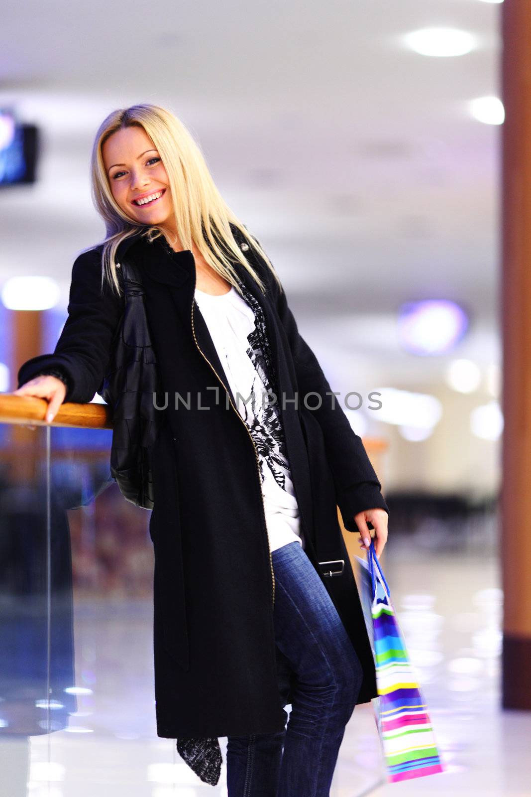 woman in shop center holds the bag in hands