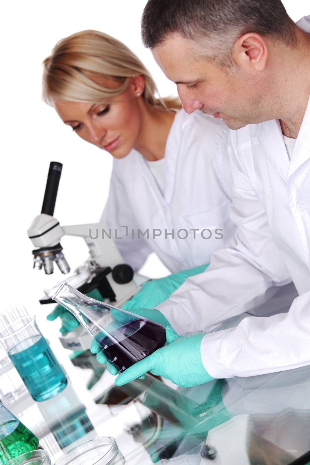 two scientist in chemical lab conducting experiments