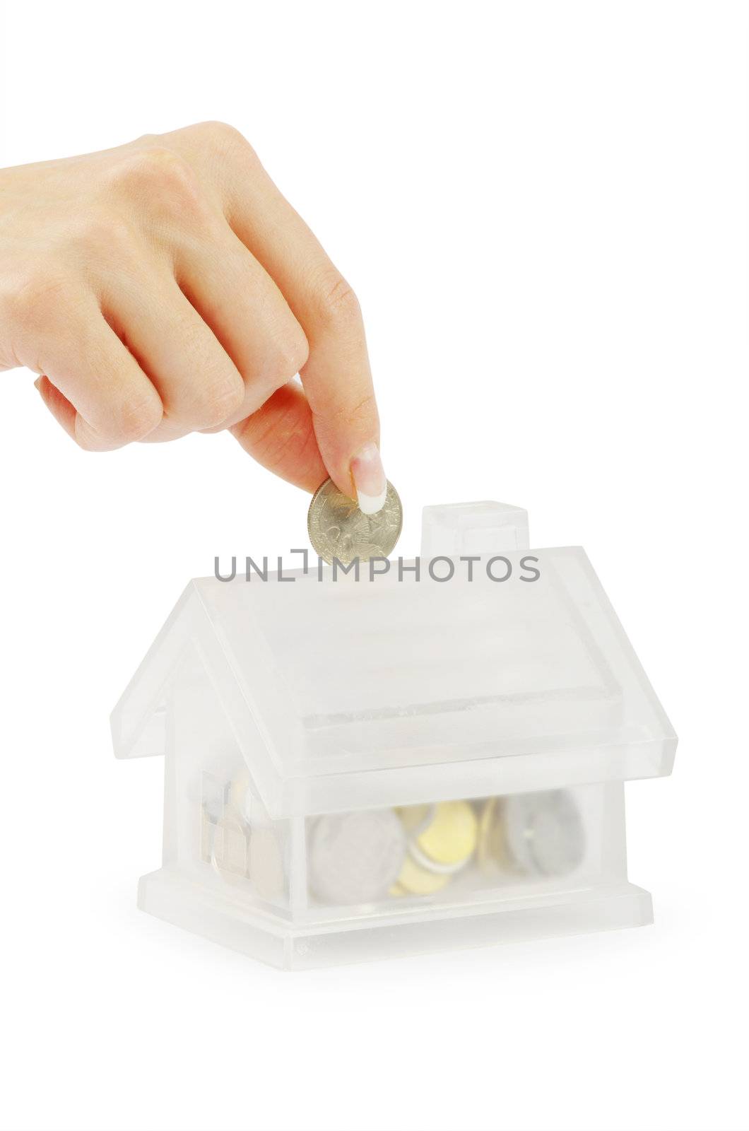 Hand with coin and house bank isolated on white background