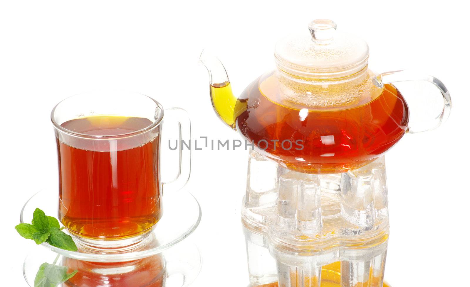 Tea being poured into glass tea cup
