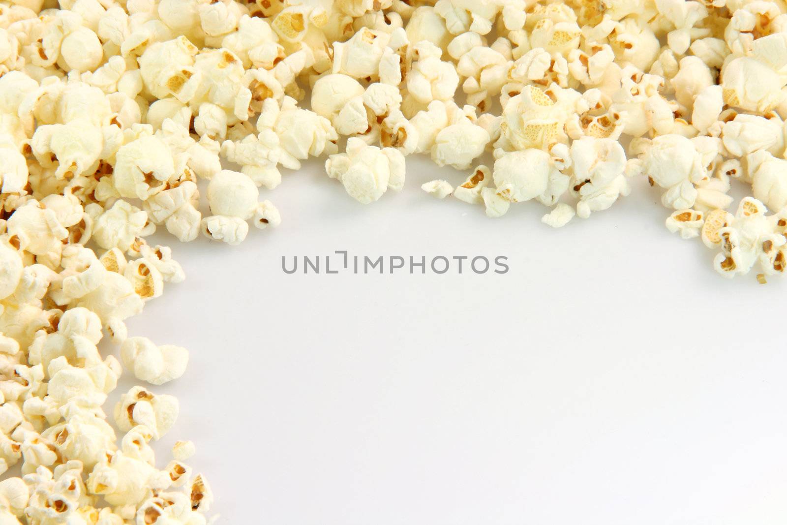 border from pop corn closeup with copy space  food and entertainment conceps