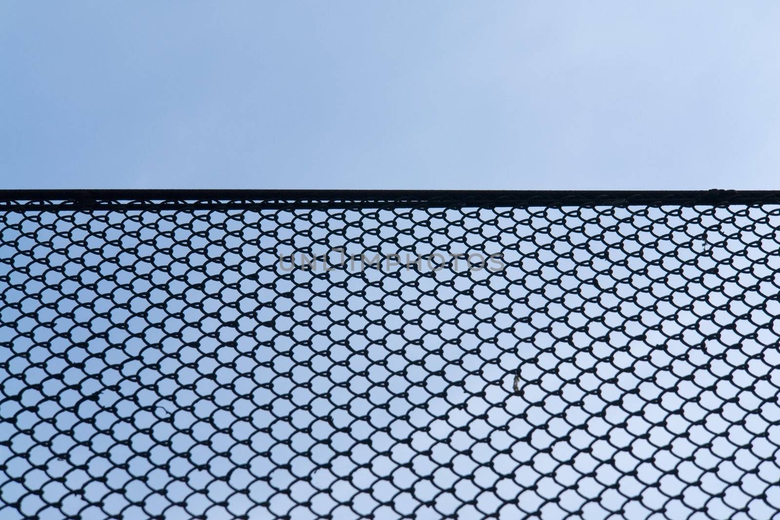 Rabitz wire netting with blue sky at background