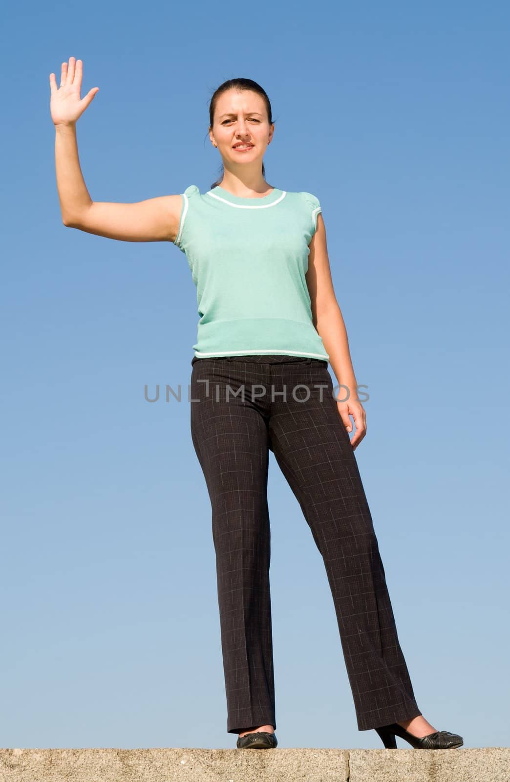 beautiful woman greeting on a blue sky