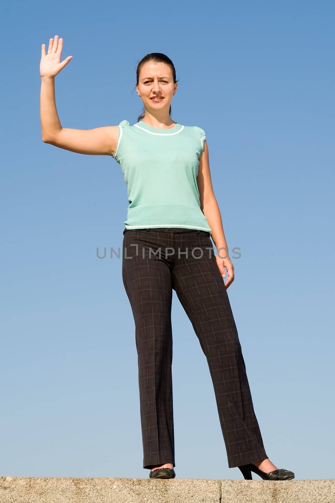 beautiful woman greeting on a blue sky