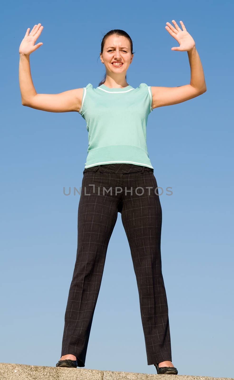 beautiful woman greeting on a blue sky