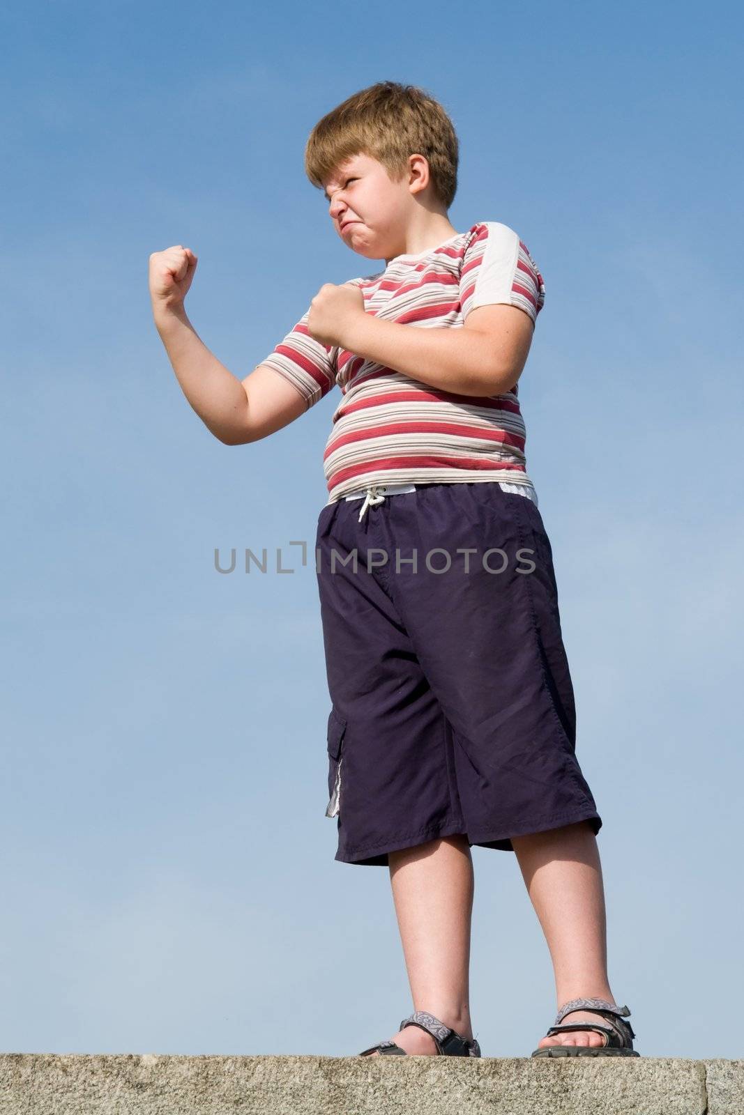 fighter boy with blue sky at background