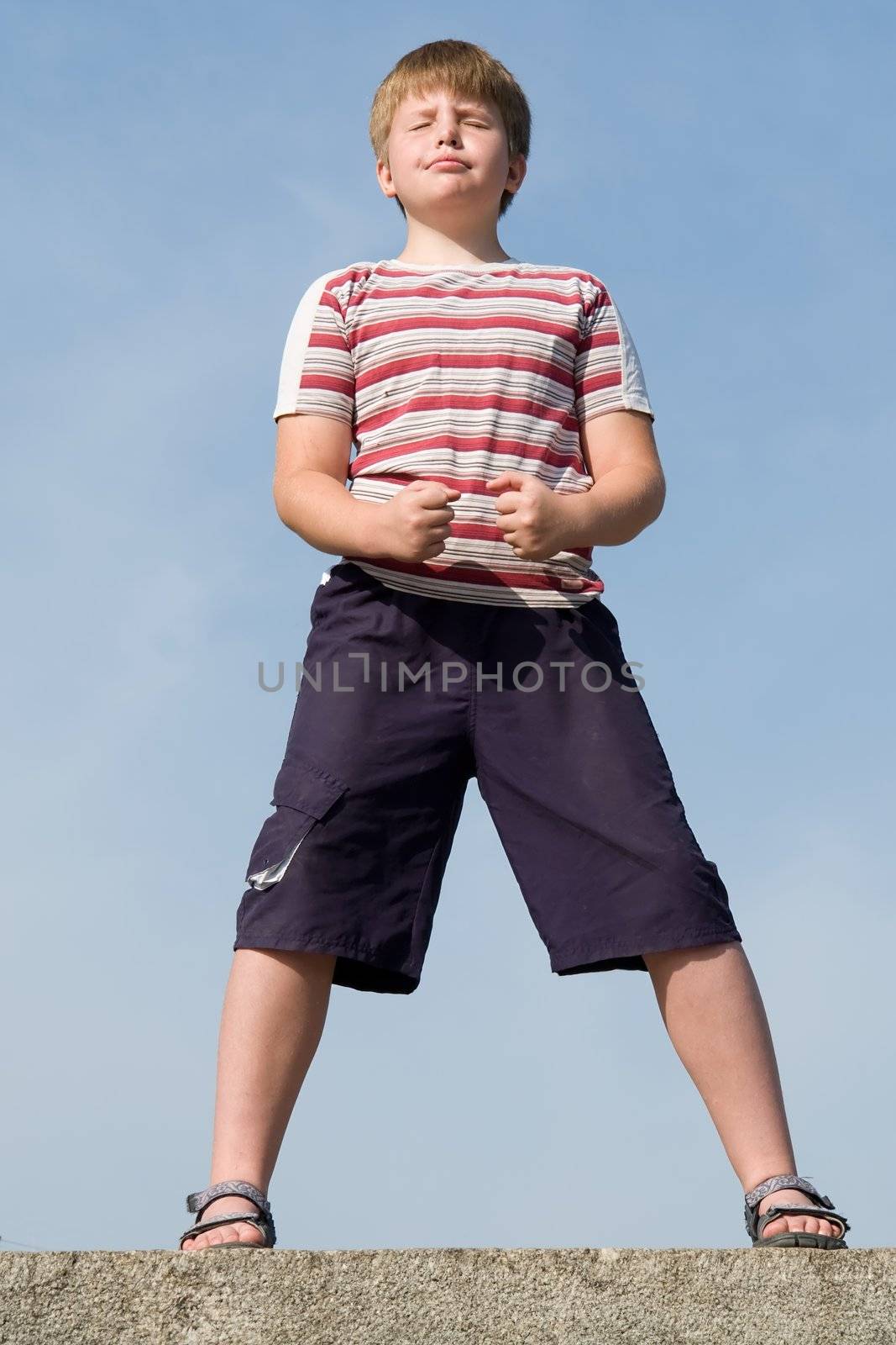 fighter boy with blue sky at background