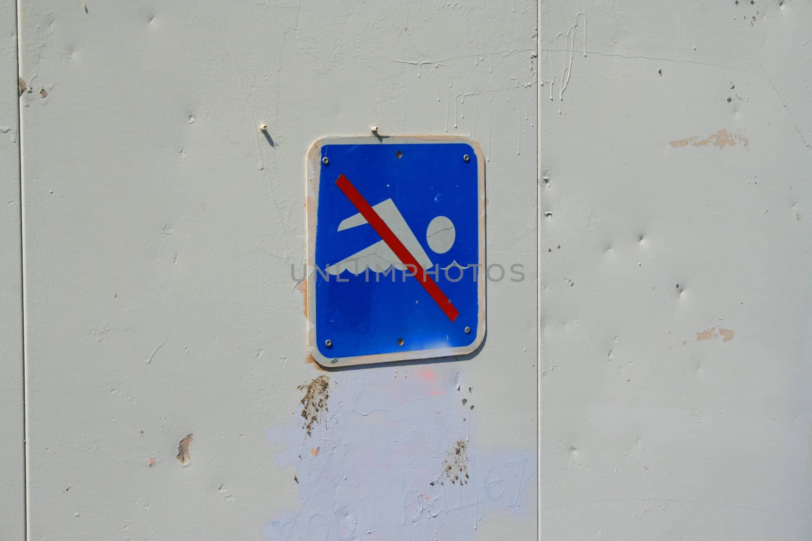 Close up of a no swimming sign.
