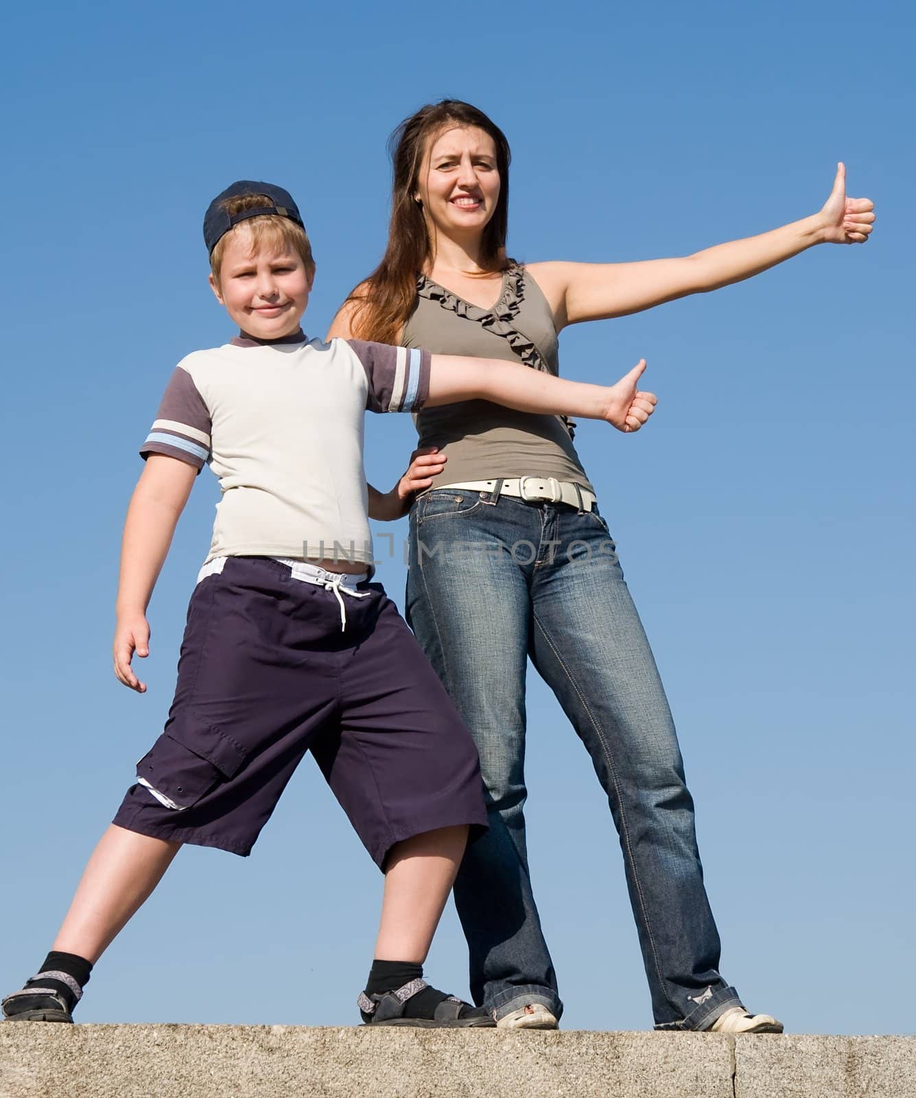 Family with thumb up on a sky background