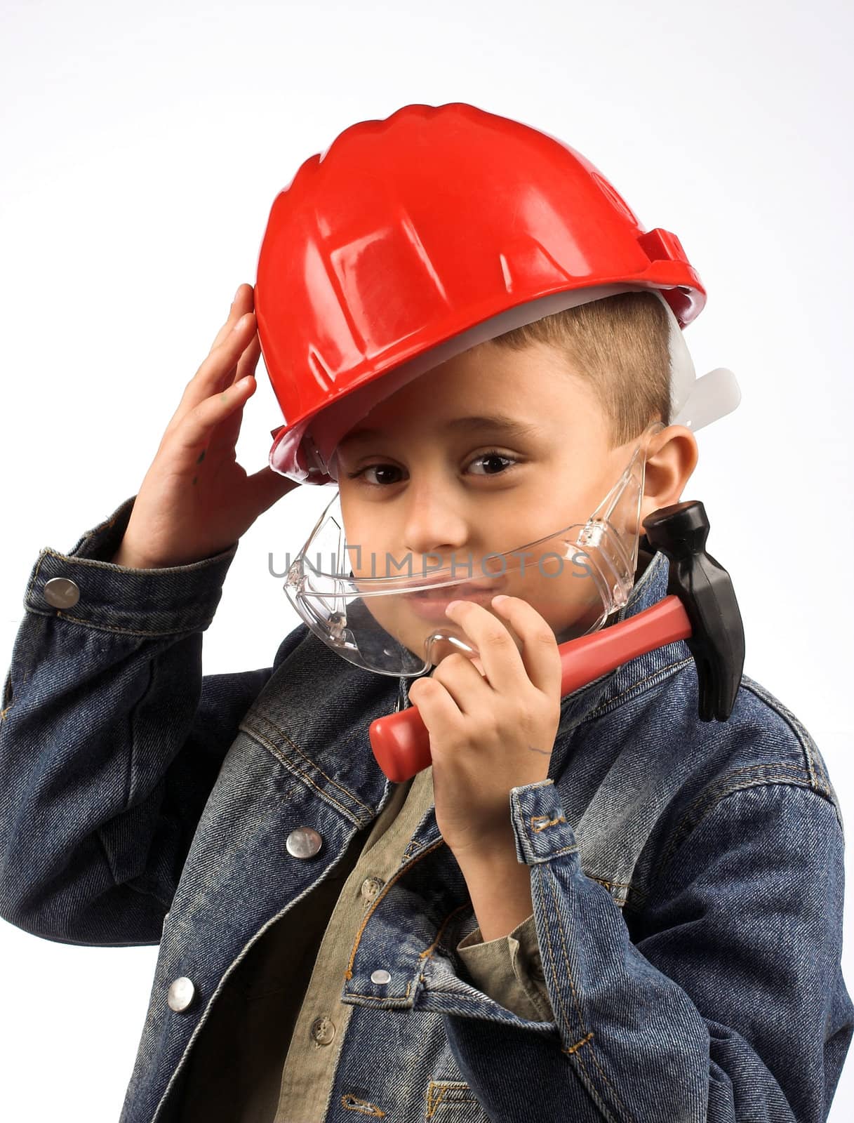 Portrait of a boy in a red protective helmet