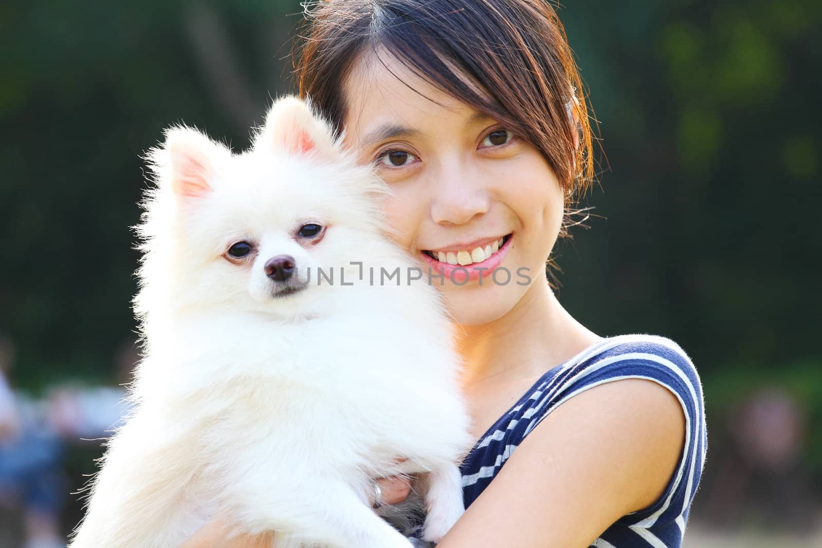 Young girl with dog by leungchopan