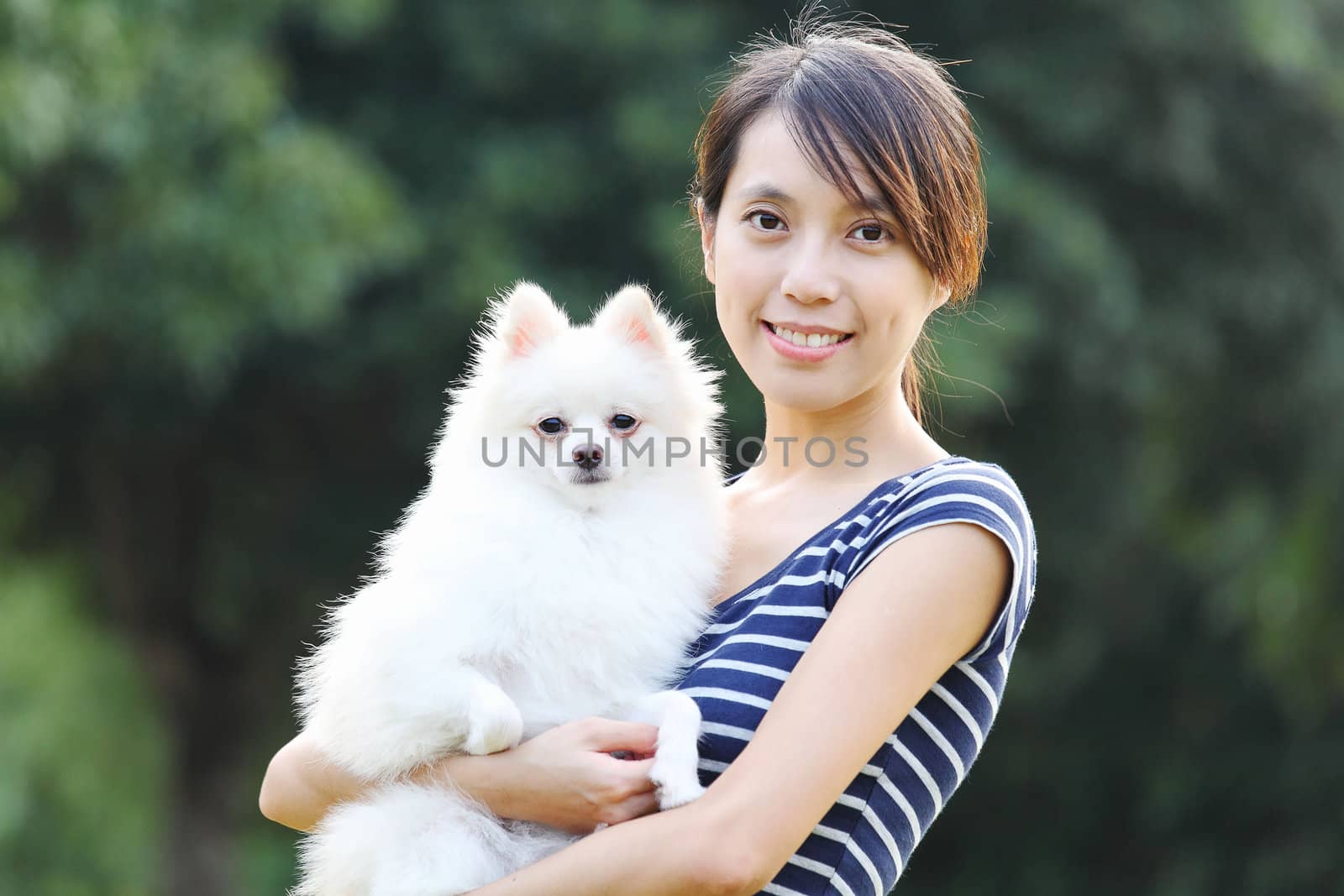 Young girl with dog by leungchopan