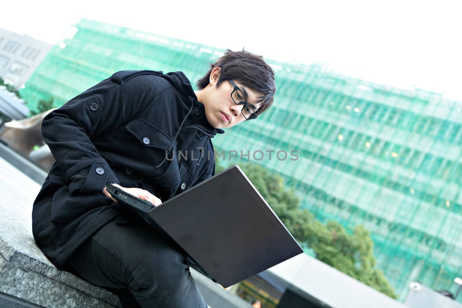 man using computer outdoor