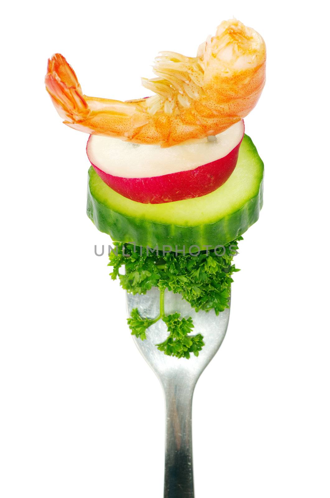 Fresh vegetables on a fork isolated on white background