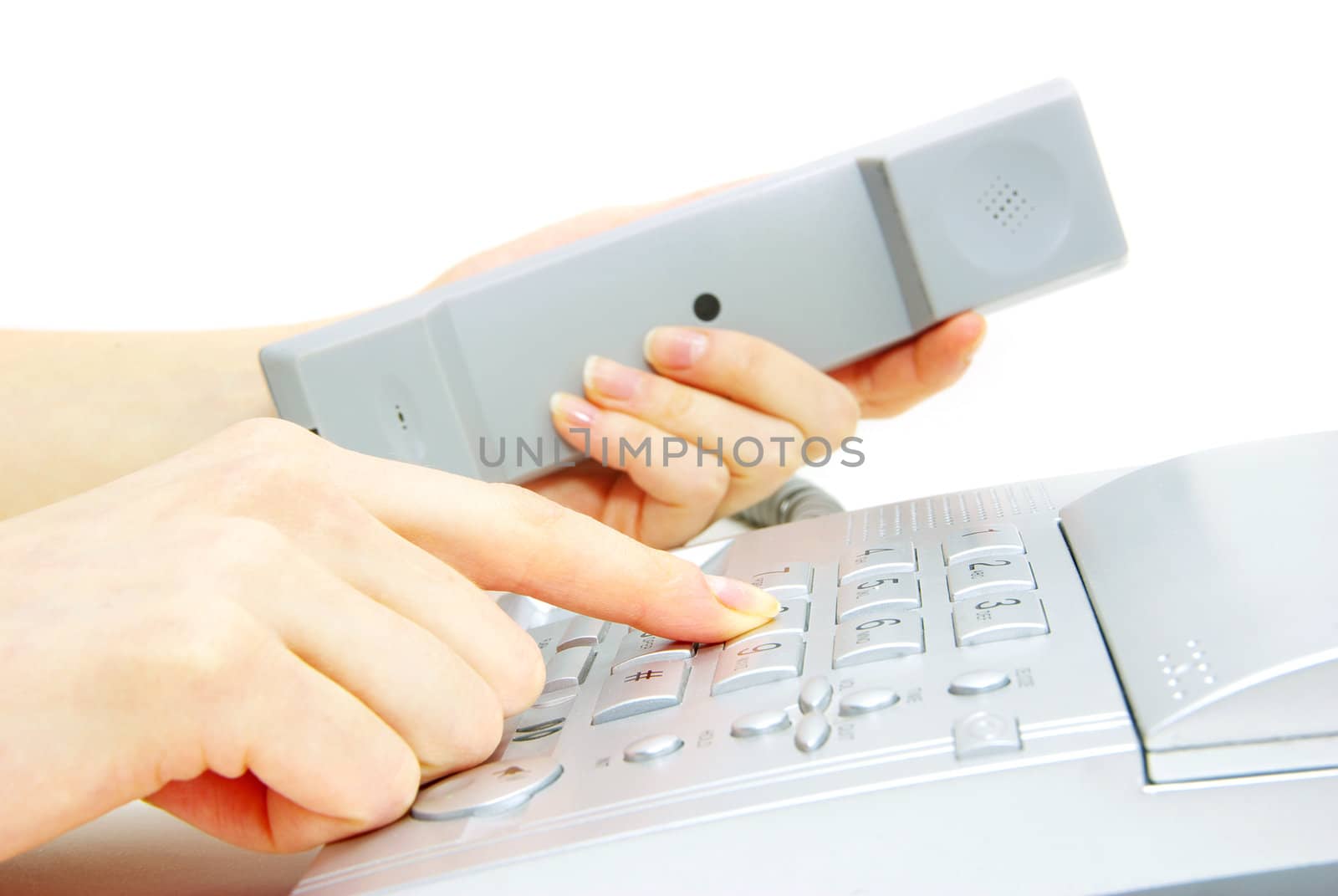 finger with  gray telephone keypad