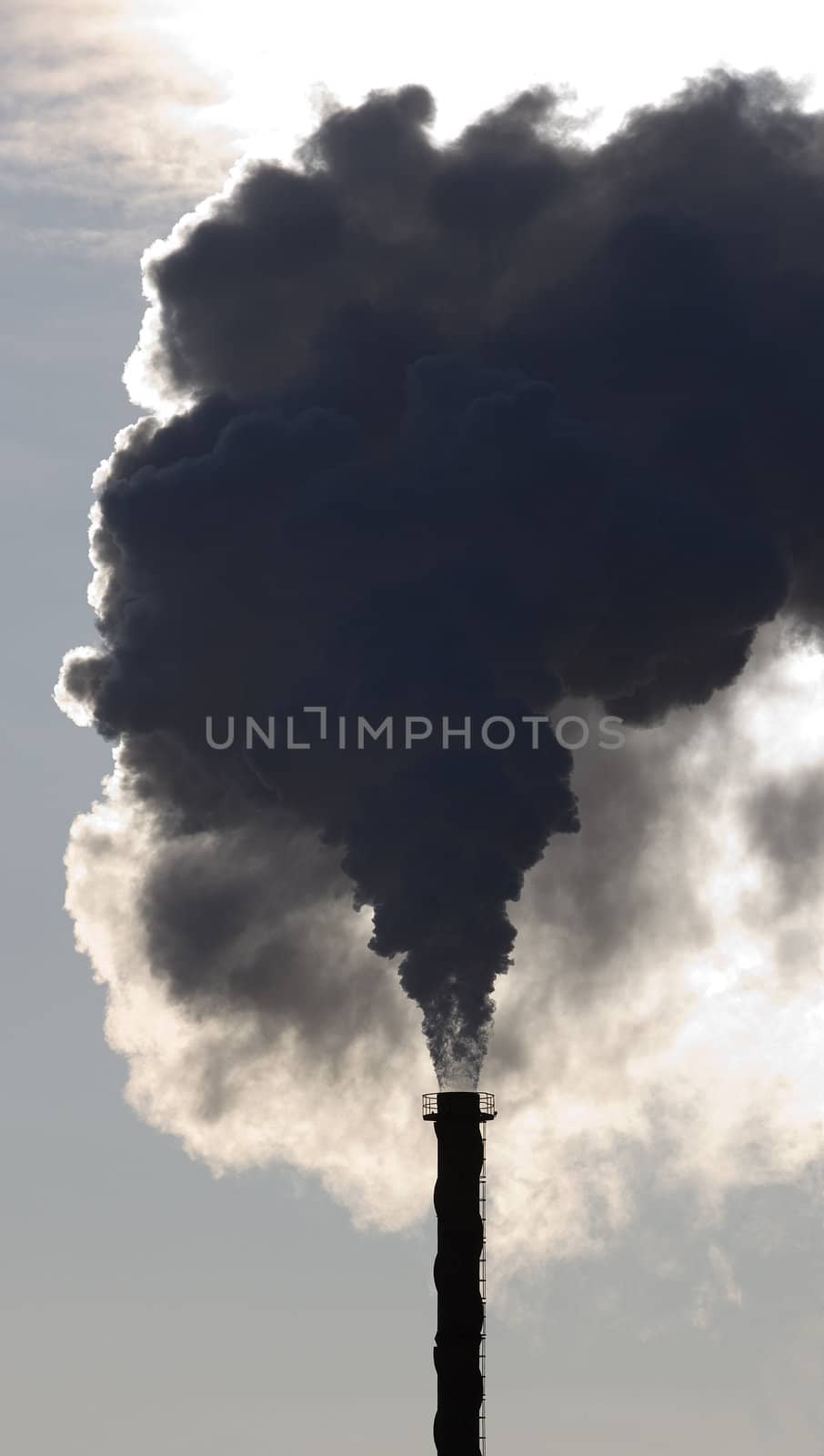 Black smoke from an industrial pipe