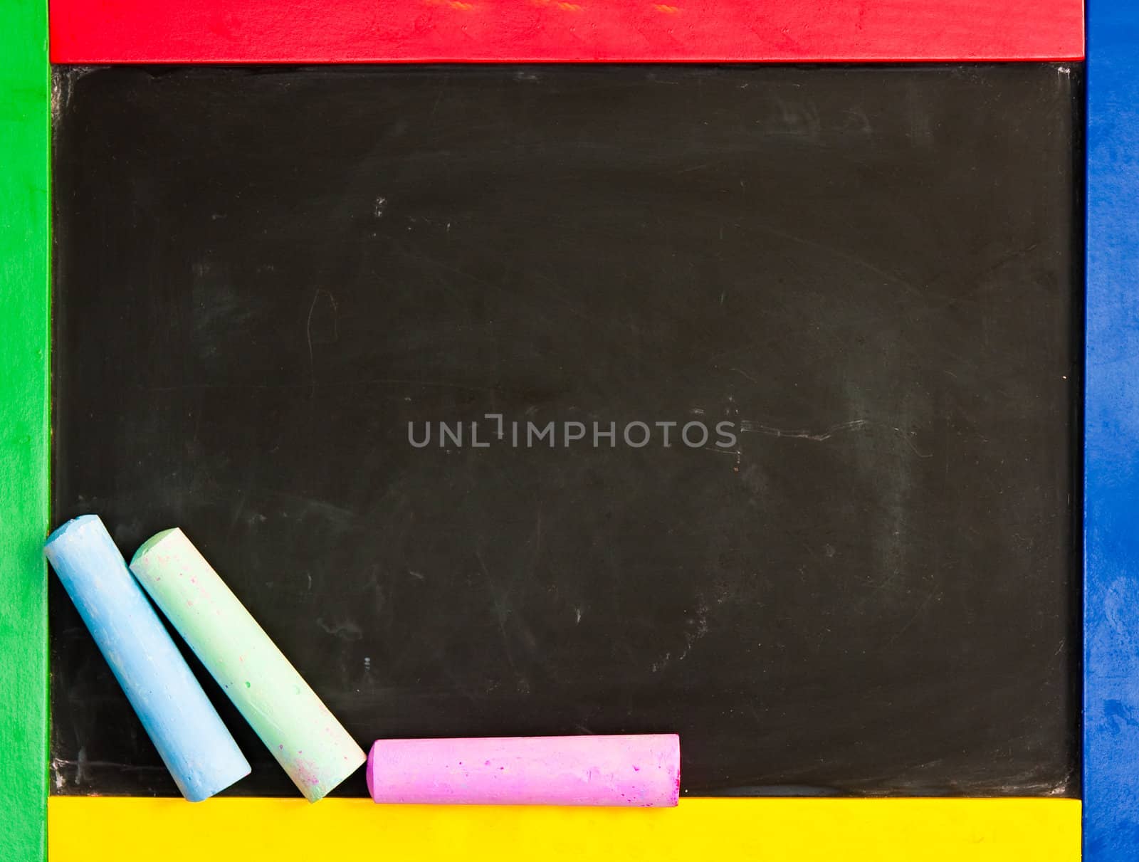 A chalk board with a colorful frame and plenty of copyspace