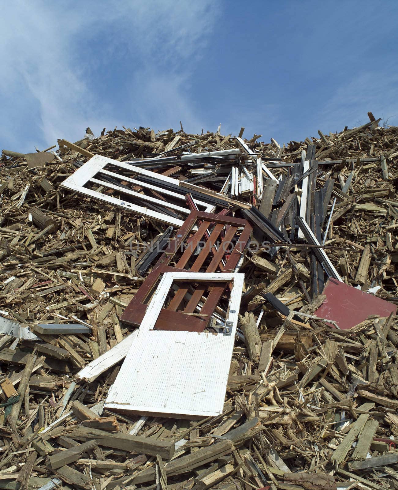 Heap of Wood Garbage in front of blue sky
