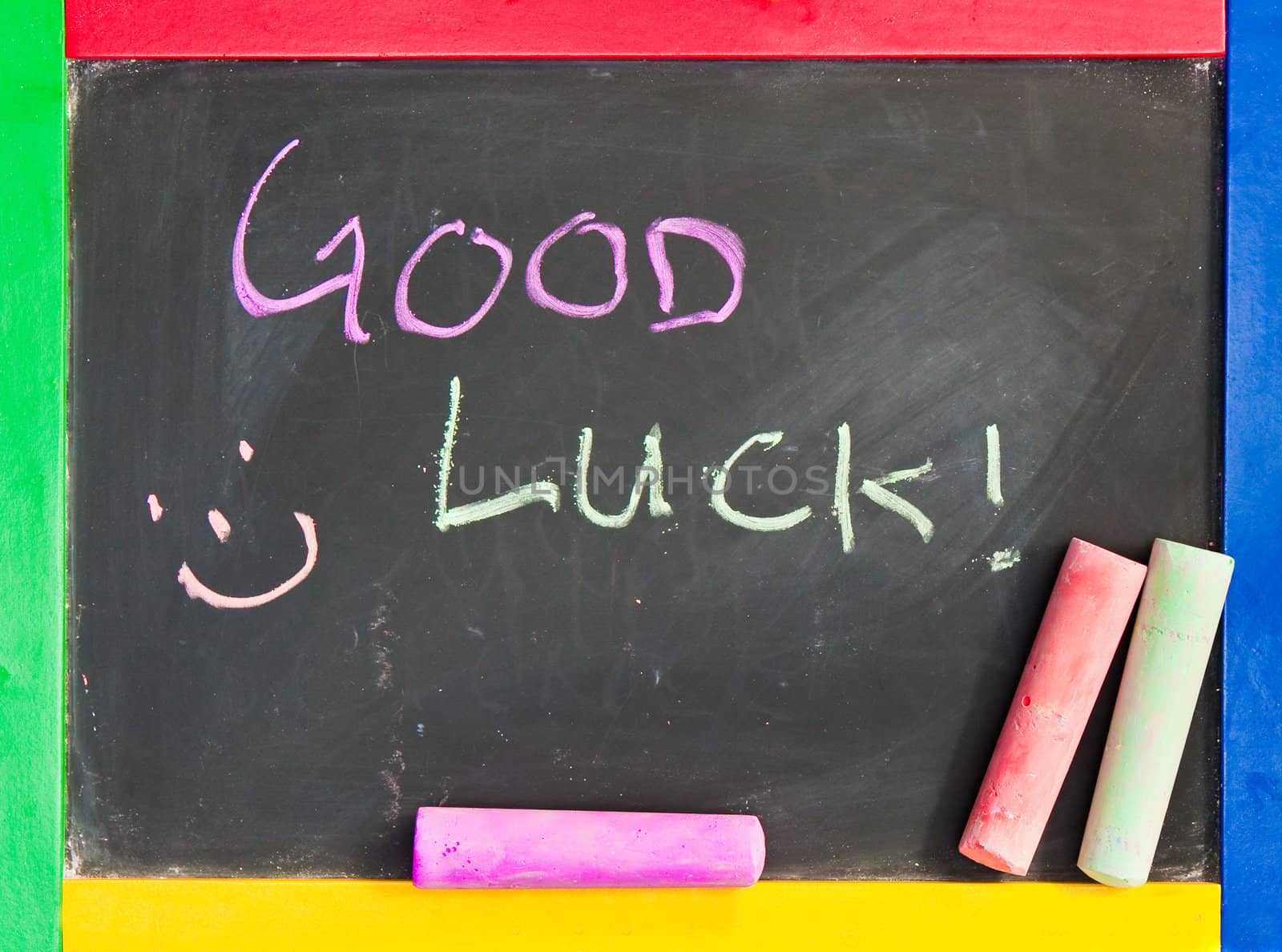 Good luck written in chalk on a black board