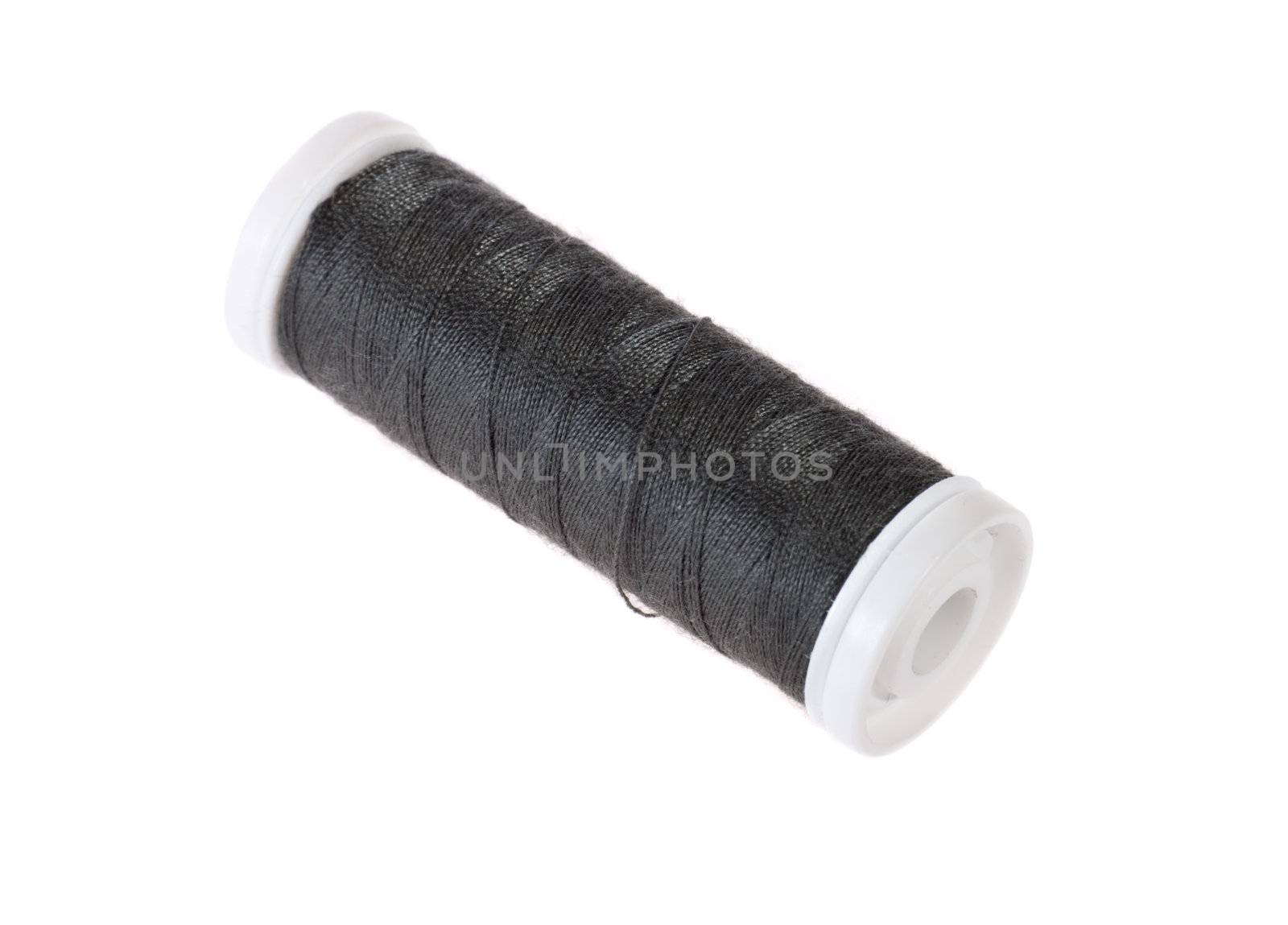Black bobbin thread isolated on white 