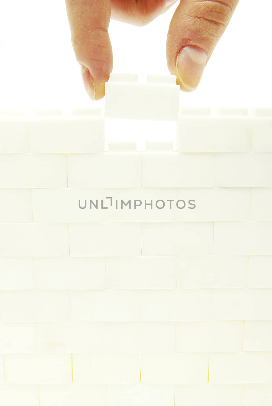 compleeting the wall on a white background