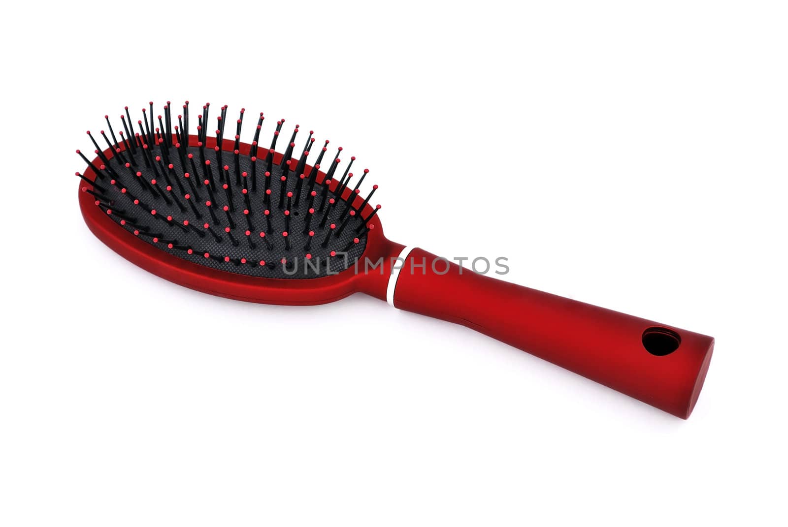 red comb the hair on a white background