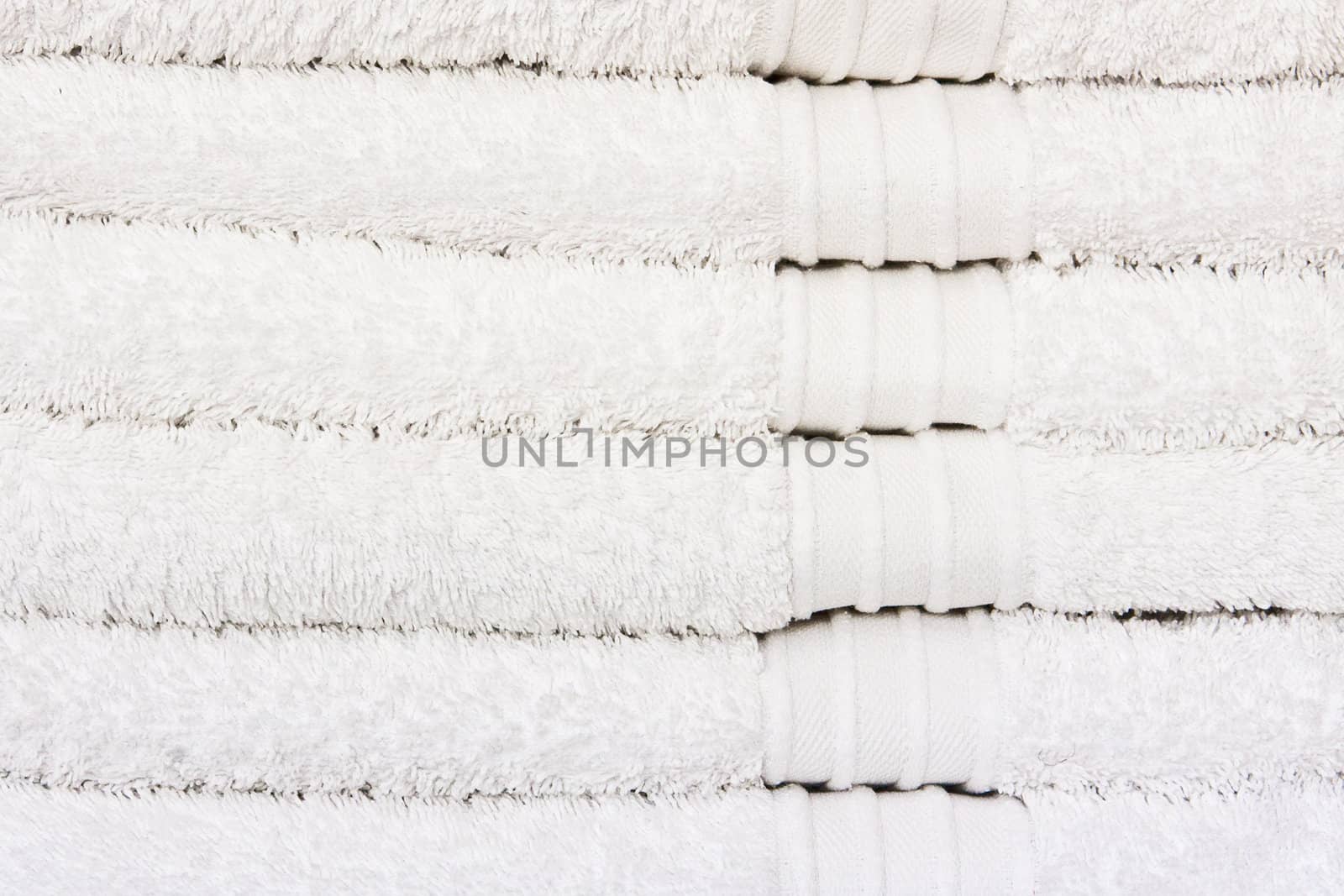 Stack of clean white towels as a background