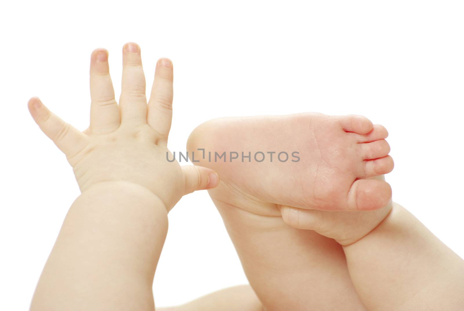 newborn baby feet and hands isolated on white