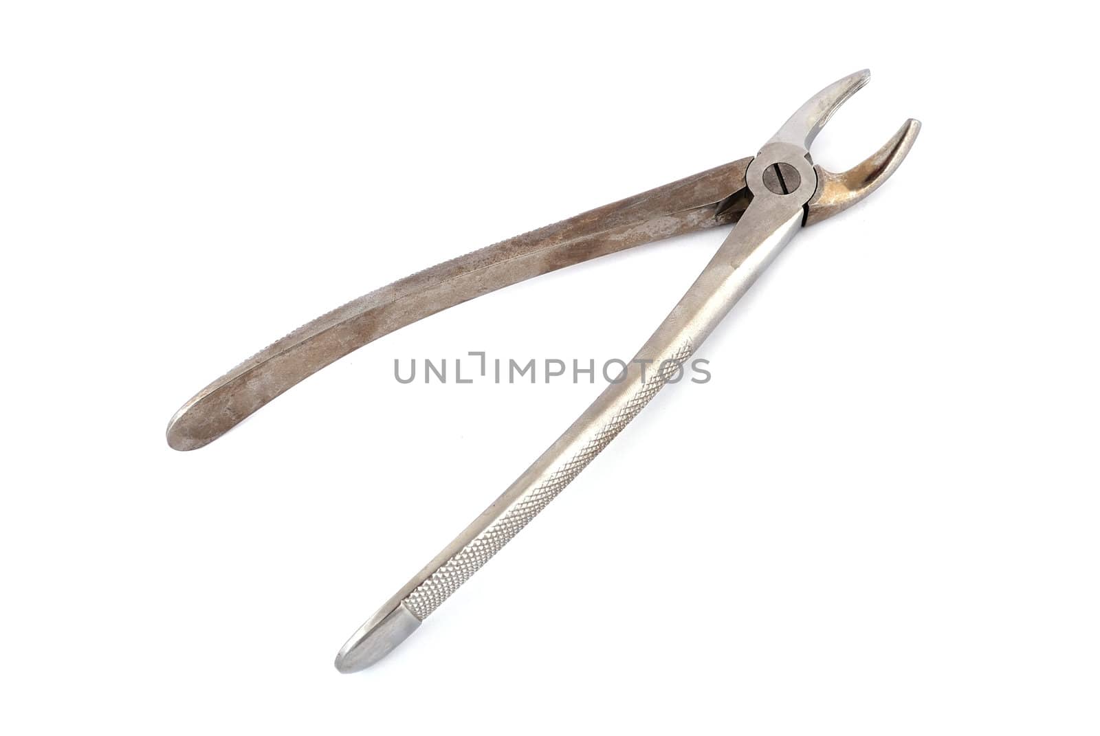 old dental pliers on a white background