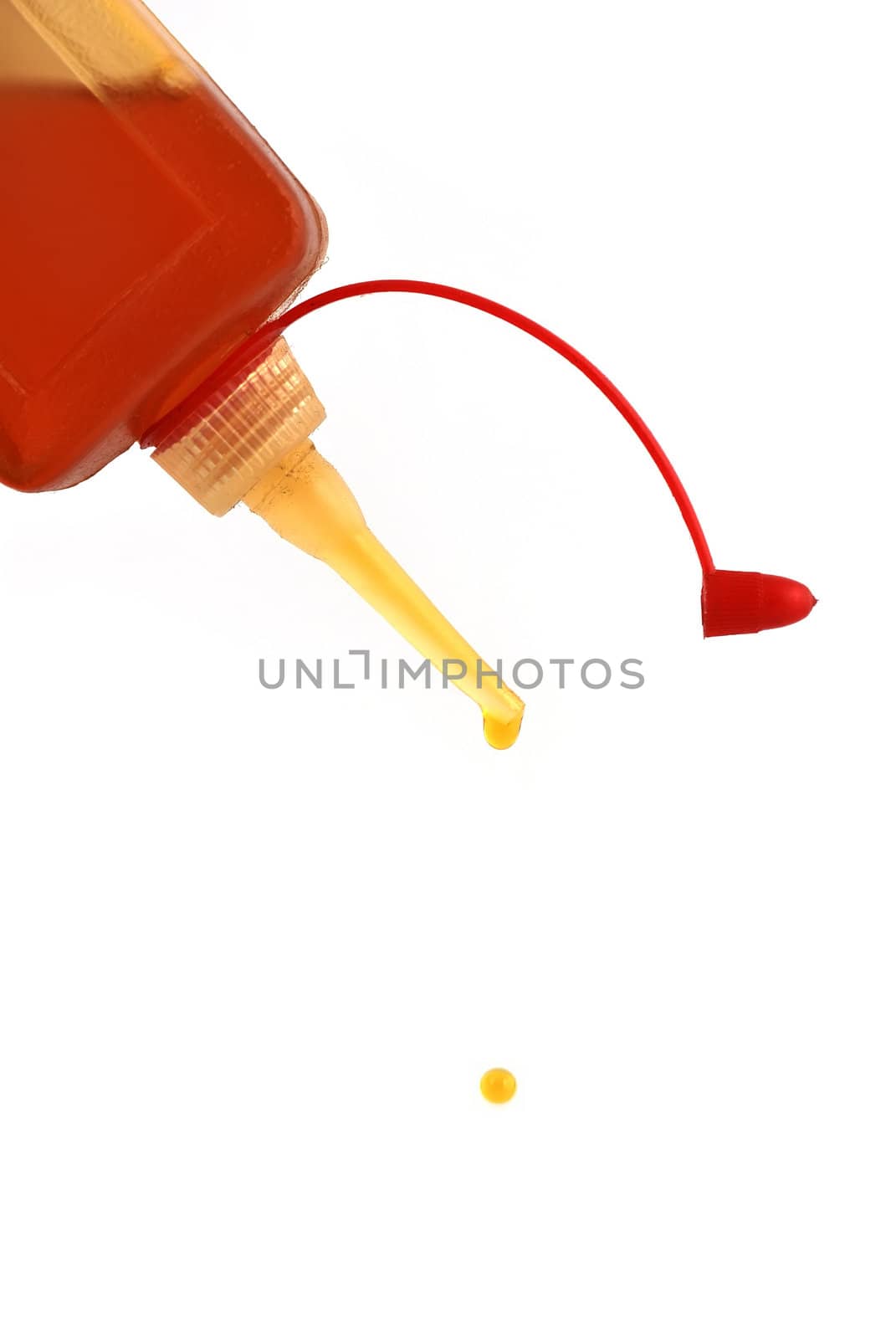 falling drops of oil can on a white background