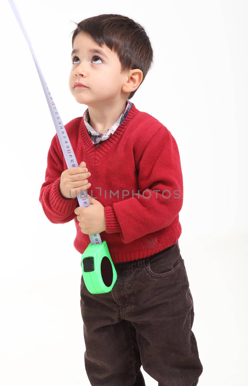 Isolated on white young boy play with meter