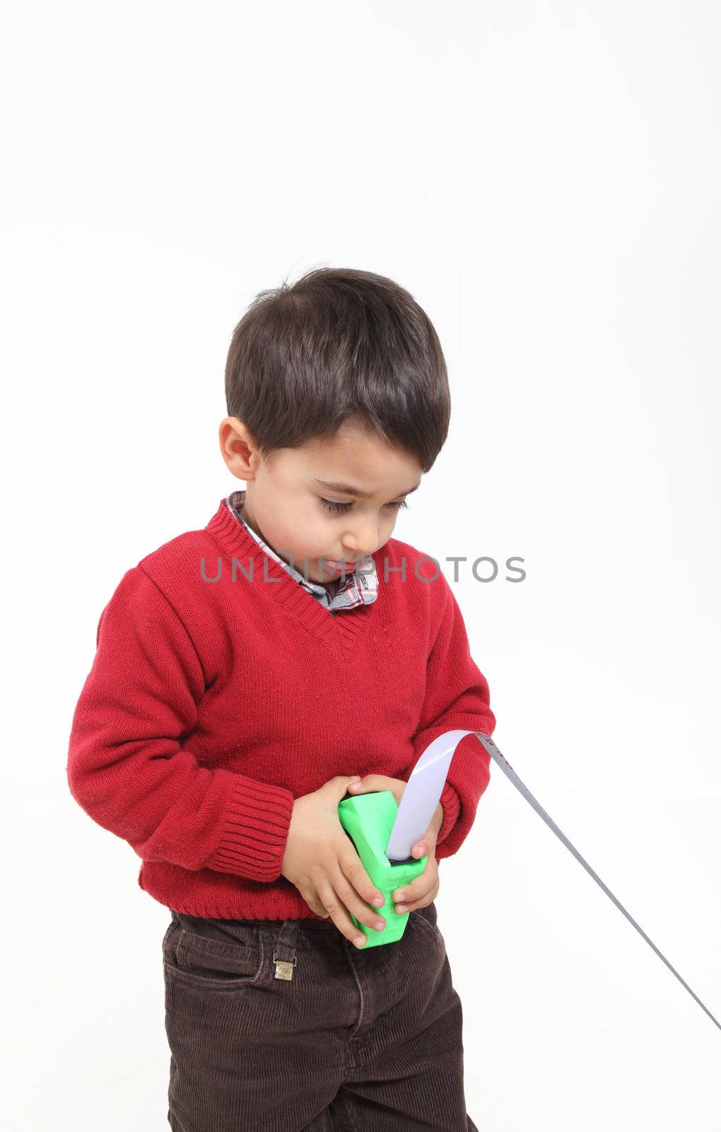 Isolated on white young boy play with meter