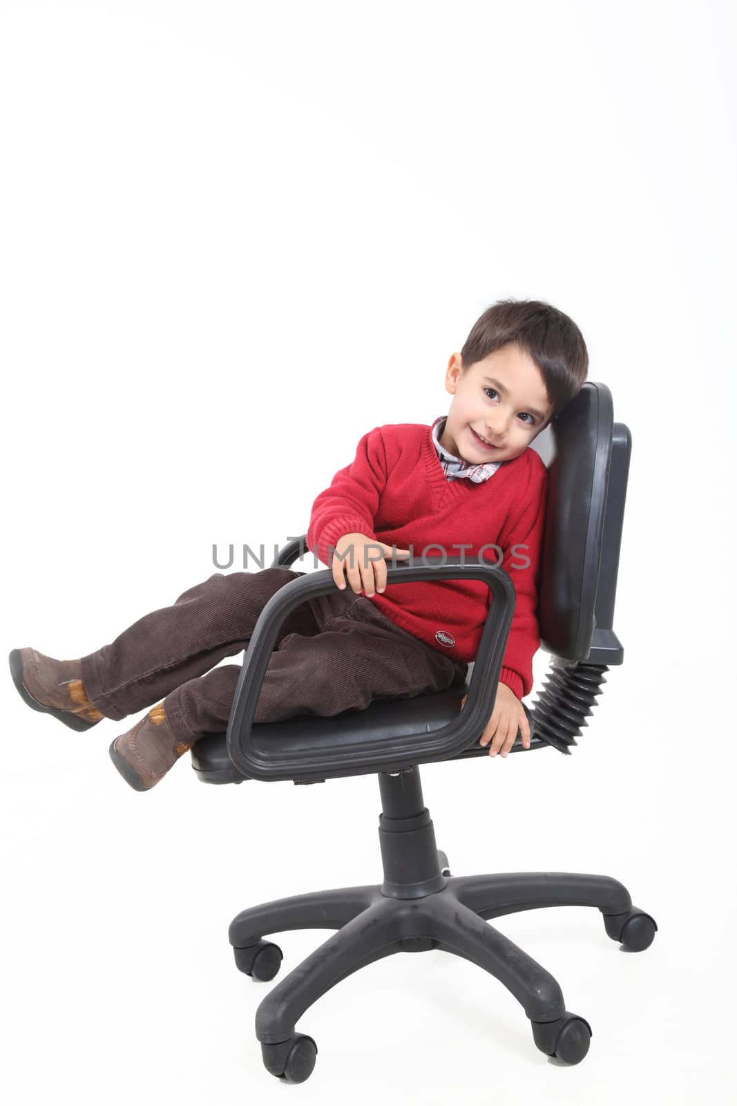 Child sitting like a boss on white background