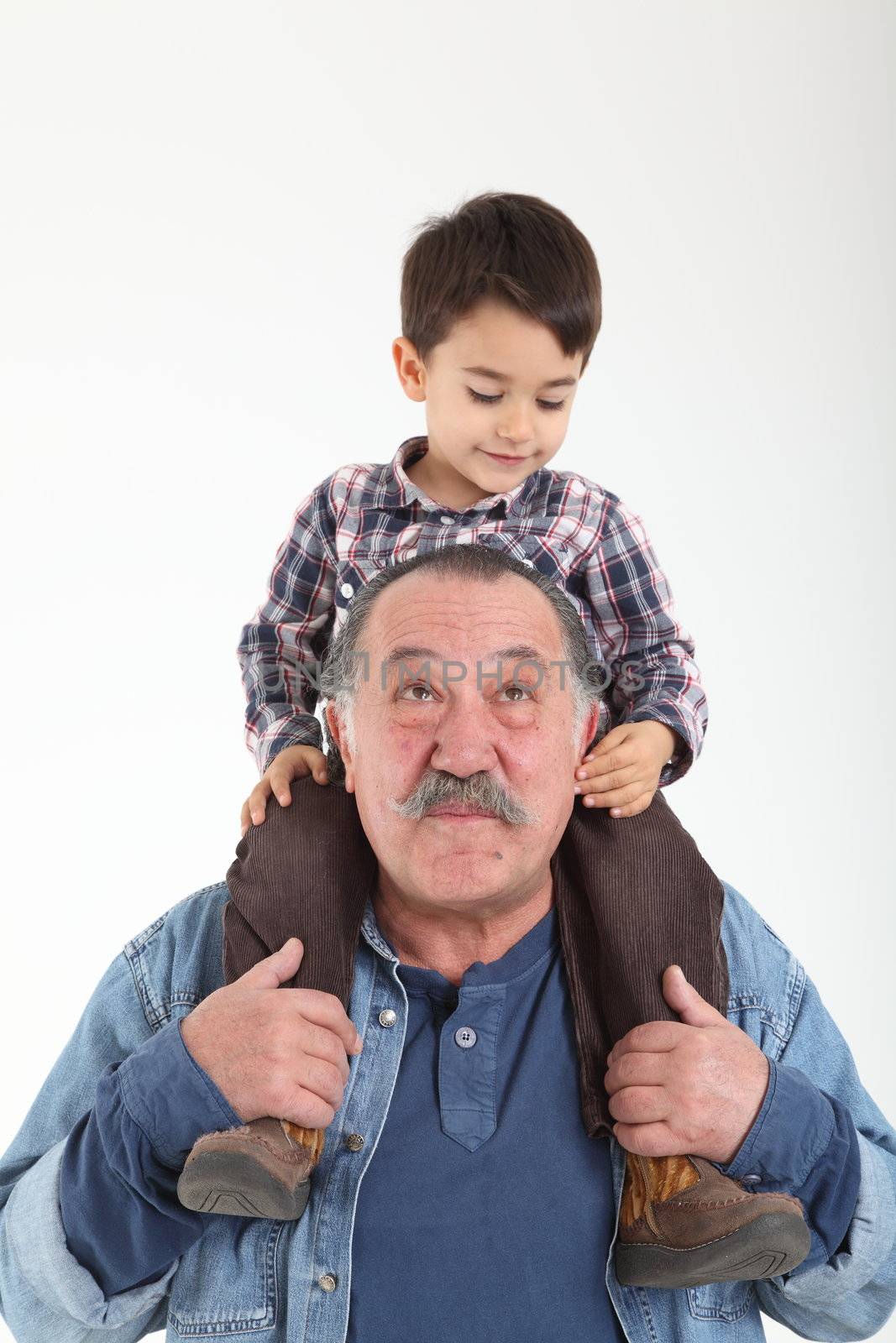 Child and grandfather stay together on white background