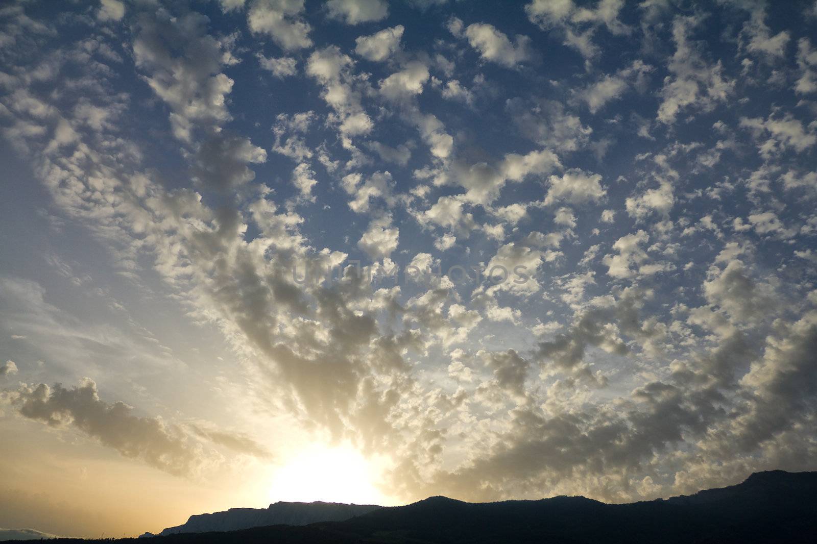 beautiful cloudscape at sunset in mountains