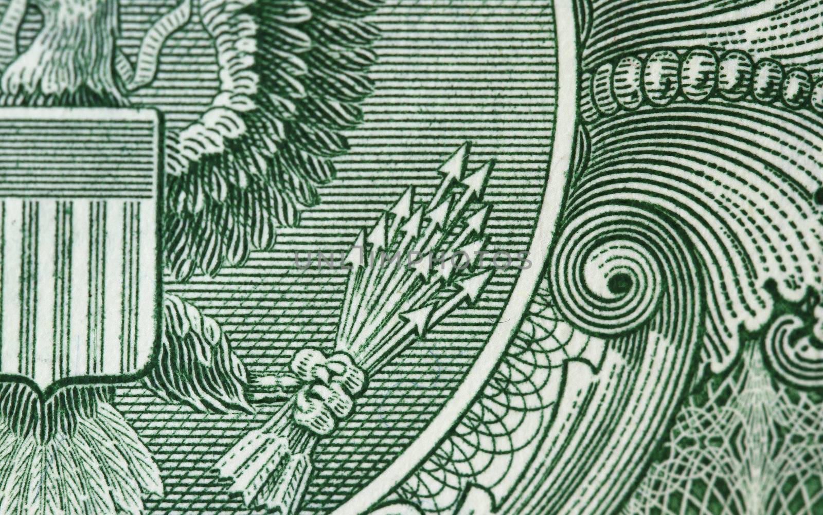 Detail of one dollar bill - with the 13 arrow as the focus subject.